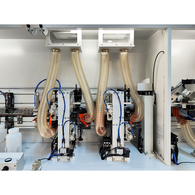 Which edges and corners does the tracking trimming function of a heavy-duty, high-speed, straight-edge banding machine handle?